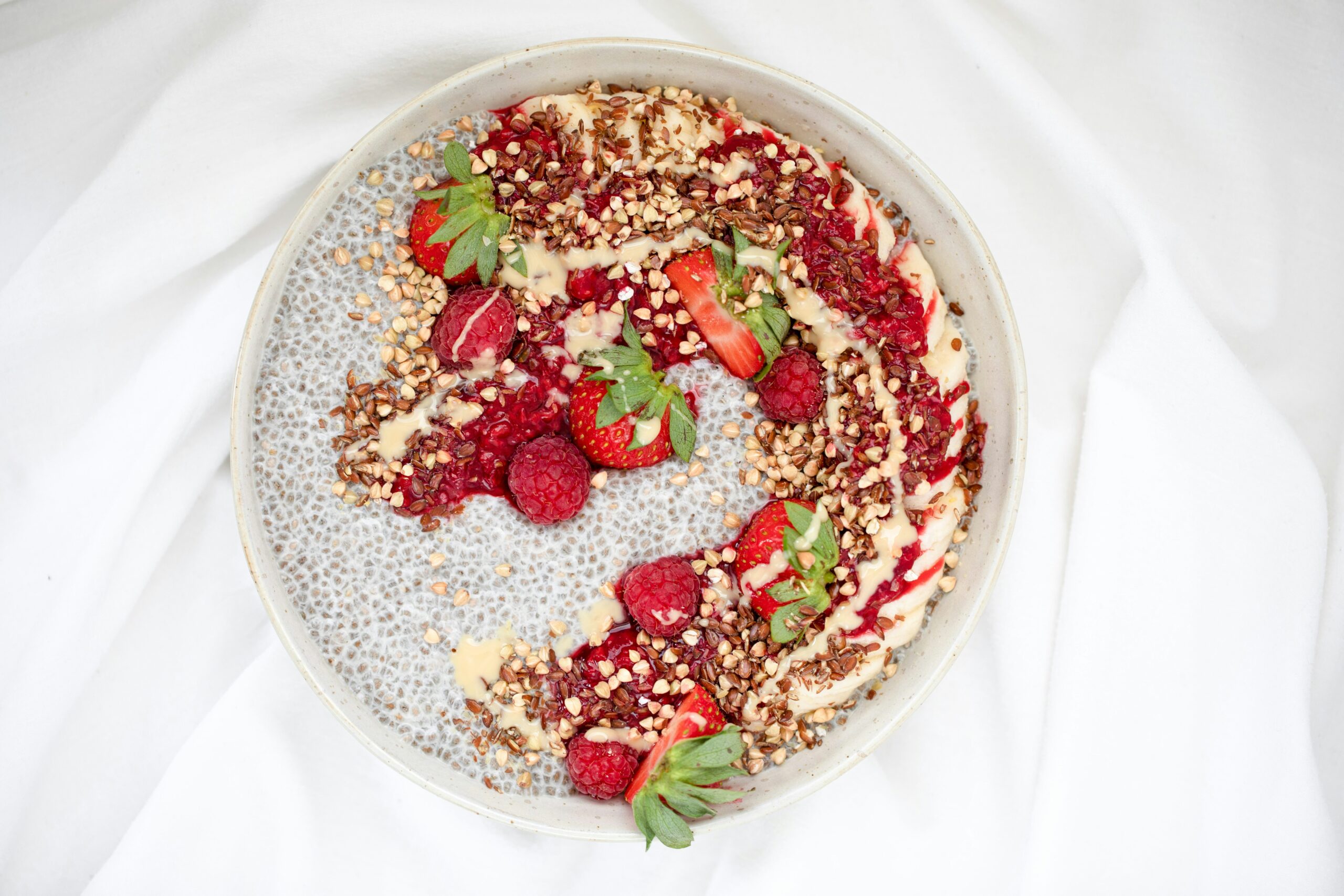 red and white fruit salad on white ceramic bowl